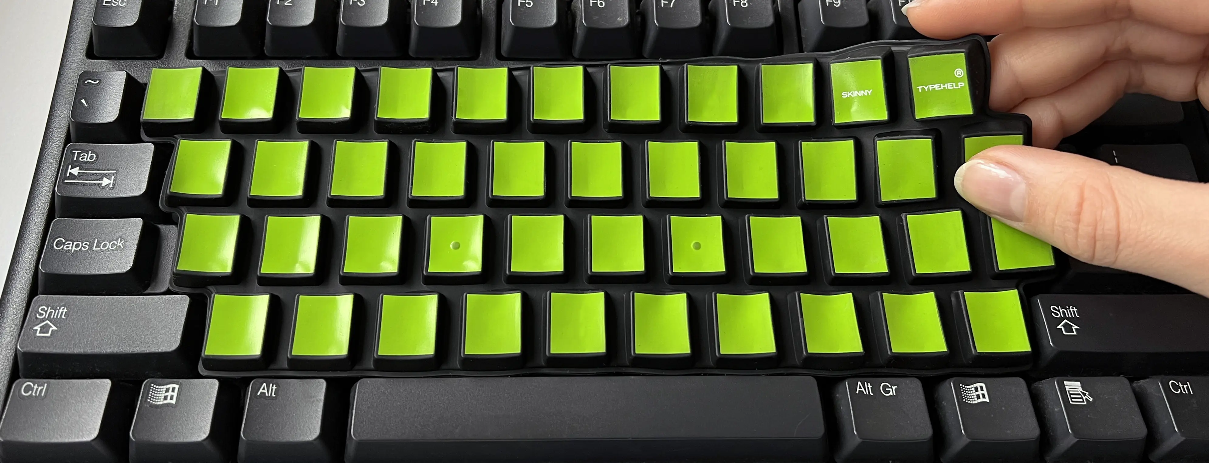 SkinnyTypehelp model DesktopPC op een los toetsenbord wordt eenvoudig verwijderd met twee vingers